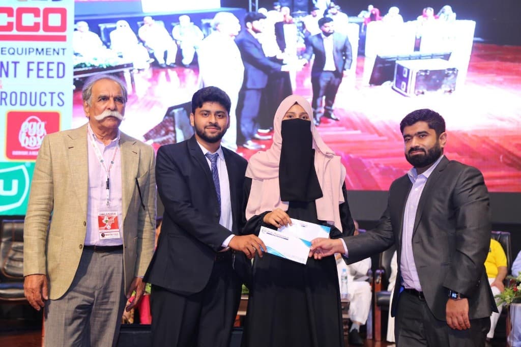 Certificate presentation during International Poultry Expo 2023 with Divine Pharmaceuticals branding visible