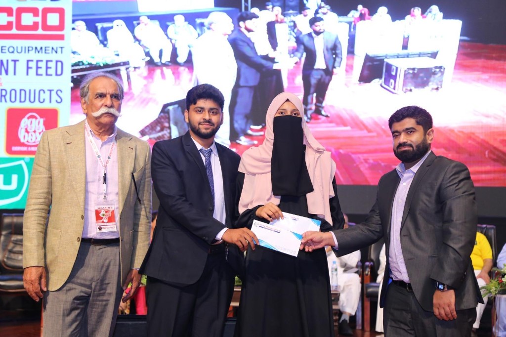 Certificate presentation during International Poultry Expo 2023 with Divine Pharmaceuticals branding visible
